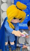 Europa mascot giving an item to a boy