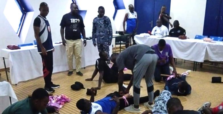 A group of men on a first aid course in training. 