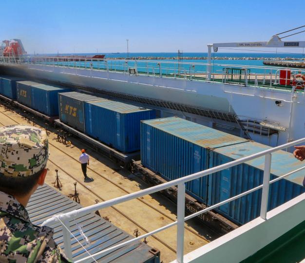 Men work in the Kazakhstan's Caspian seaport of Aktau