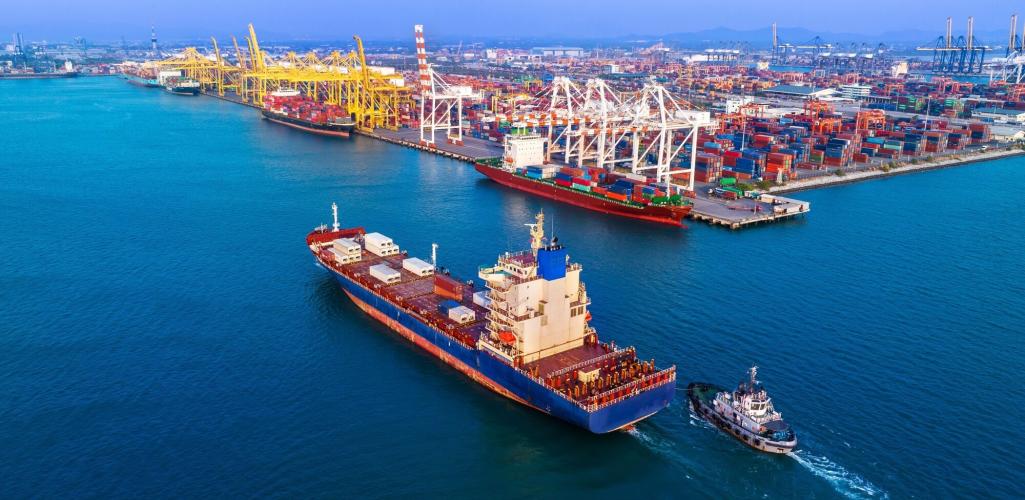 A cargo ship docking in a busy port. 